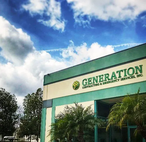 Exterior view of the Generation Contracting headquarters in San Diego with blue sky and a commercial building facade.