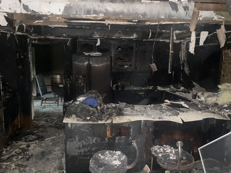 House fire with smoke damage throughout - before photo of kitchen
